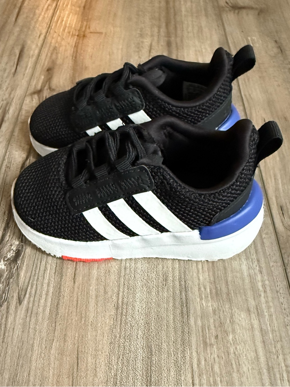 Toddler Black Adidas Sneakers with White Stripes and Blue Heel Size 4